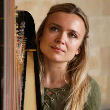 catriona holds a harp