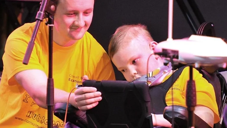 child playing music on ipad