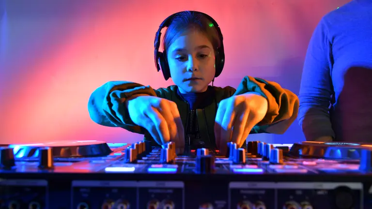 Child on the deck wearing headphones 