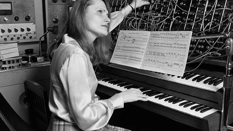 wendy carlos plays an early synthesizer. the photo is in black and white