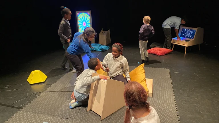 Image of children playing on multisensory equipment.