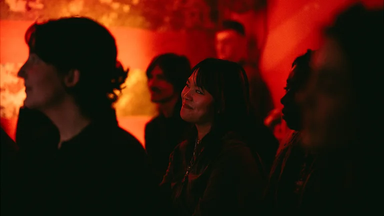 a crowd of people watch a performance
