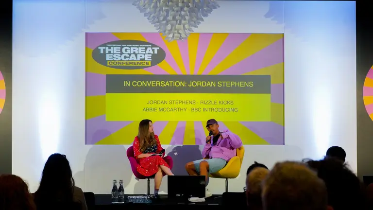 abbie mccarthy and jordan stephens on a panel