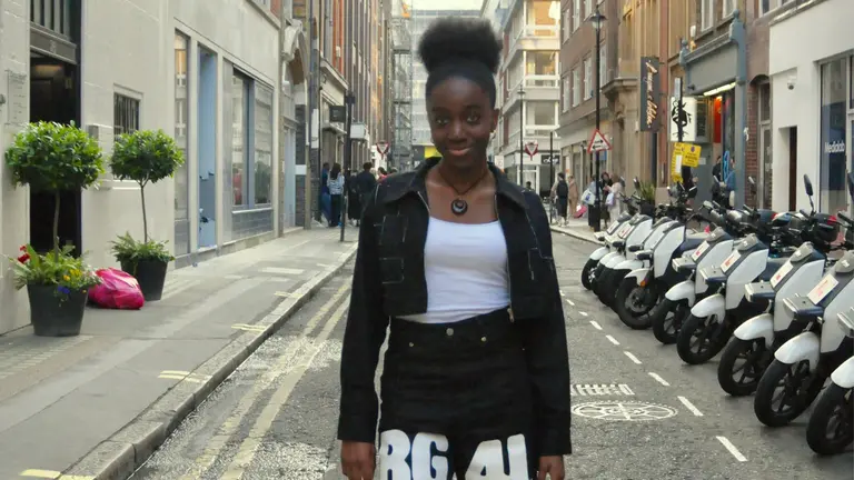 alice-lily wears a monochrome outfit and poses in a London street.