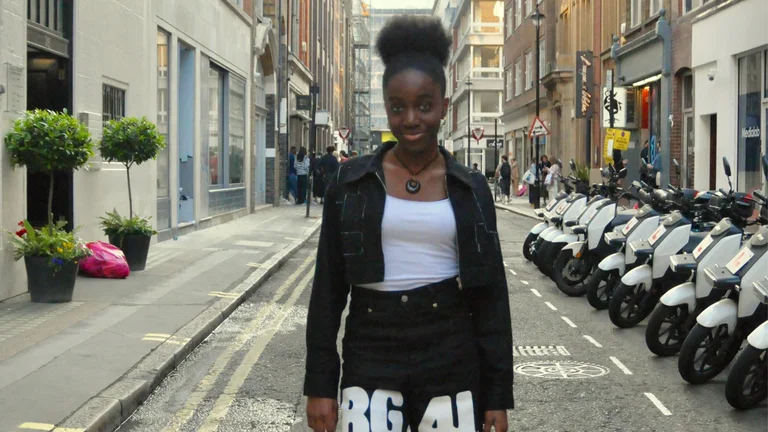 alice-lily wears a monochrome outfit and poses in a London street.