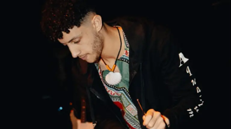 elijah is pictured playing a drum