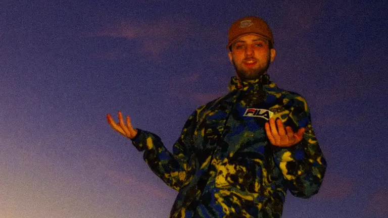 finbarr wears a camouflage fleece and a brown hat