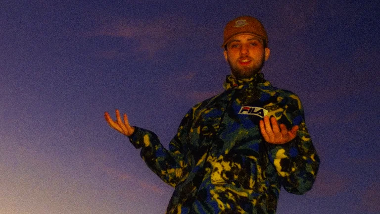 finbarr wears a camouflage fleece and a brown hat