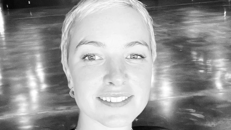 Image of Billie in black and white in a car park