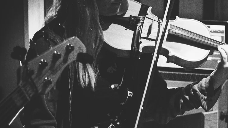 a woman plays violin