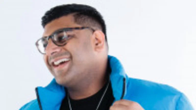 image of jameel shariff in a blue collared jacket smiling