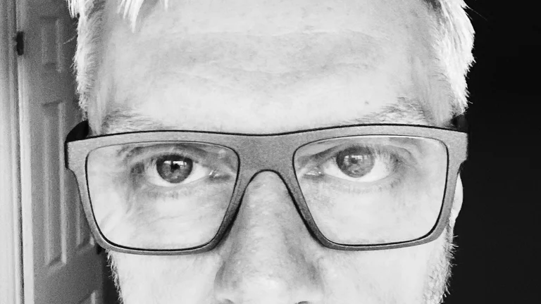 headshot of Andy Dawson in black and white