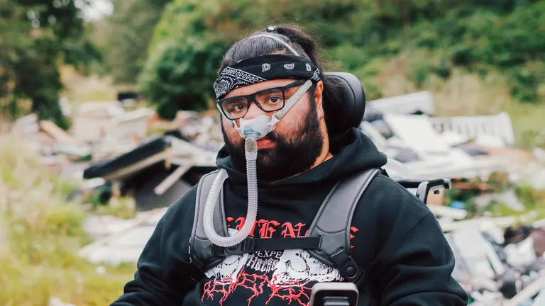 supermann on da beat with a bandana photographed outside on a rocky path