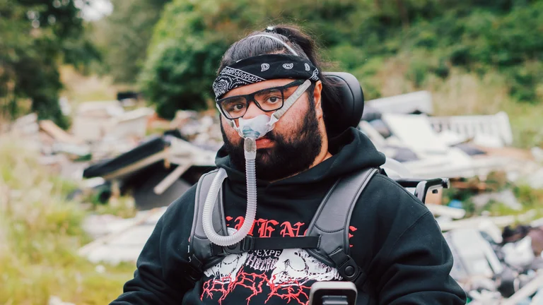 supermann on da beat with a bandana photographed outside on a rocky path