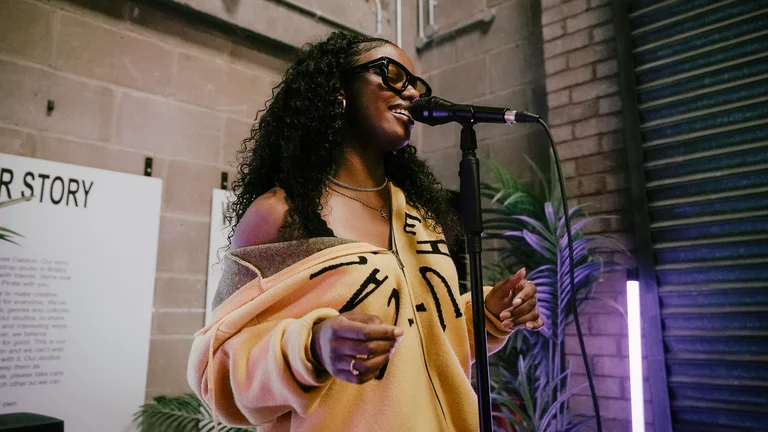 bruna garcia performs into a mic 