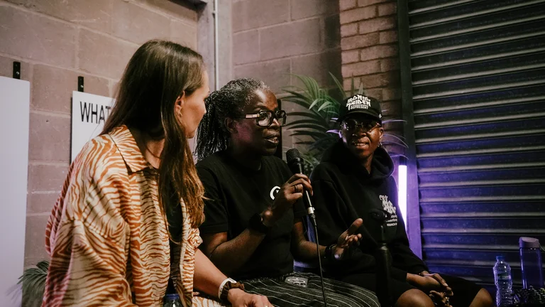 panel of people with one speaking into a mic