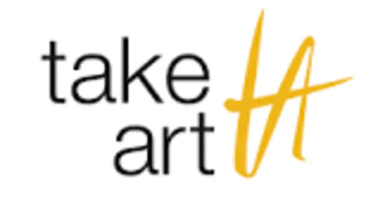 take art logo. White logo, 'take art' written in lower case black text, with a 'TA' logo in gold writing