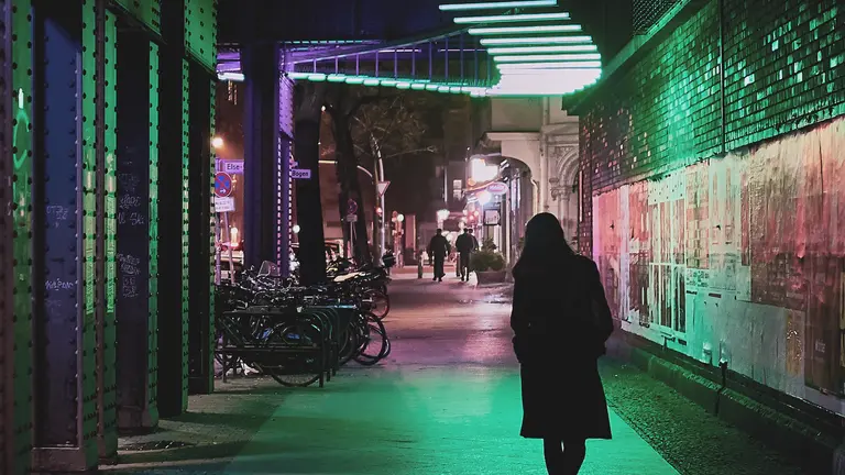 a person walking alone at night