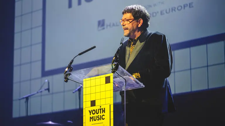 Matt Griffiths CEO, doing a speech at the Youth Music Awards 2025, at a lectern 