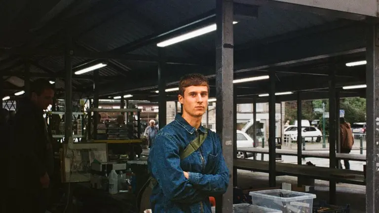 bastet leans against a pole