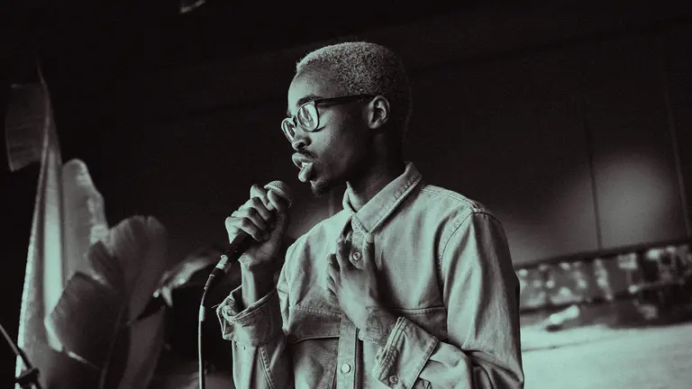 cafil holds a microphone