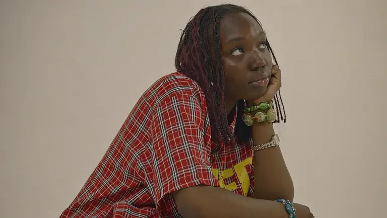 gracee leans forward and rests her chin in her palm