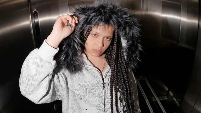 jayahadadream wears a grey hoodie lined with fur