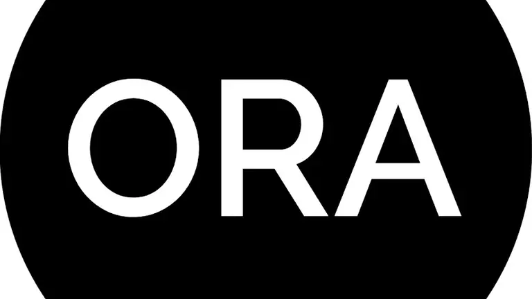 Black circle with white writing saying ORA