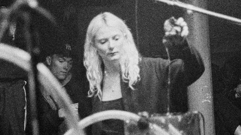 a woman with blonde hair is photographed in black and white