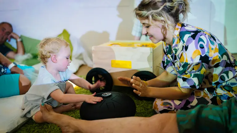 child and woman playing together