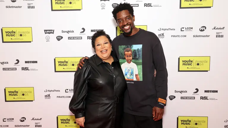 Youth Music's co-chairs Guvna B and Charlotte Edgeworth posing at the Youth Music Awards 2025