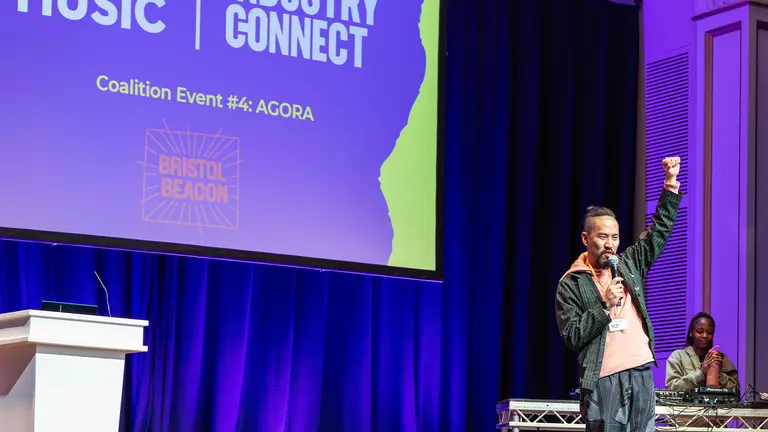 a man gives a speech on stage