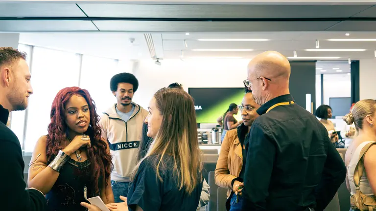 people networking in an office building room