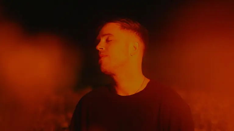 Benjamin surrounded by orange light