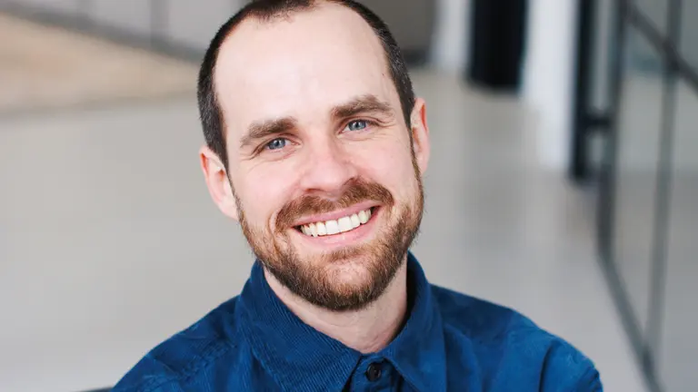Colin's headshot, smiling