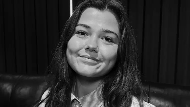 Beth Neale Headshot, smiling in black and white