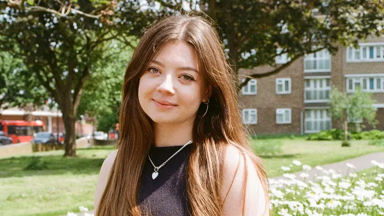 Jodie Luckie headshot, outside on a lawn in summer