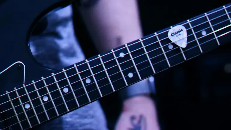 close up of a black electric guitar