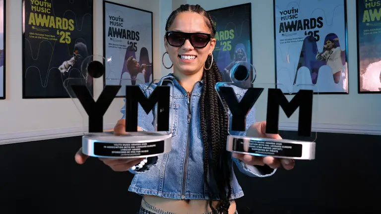 jayahadadream proudly holds out her two youth music awards