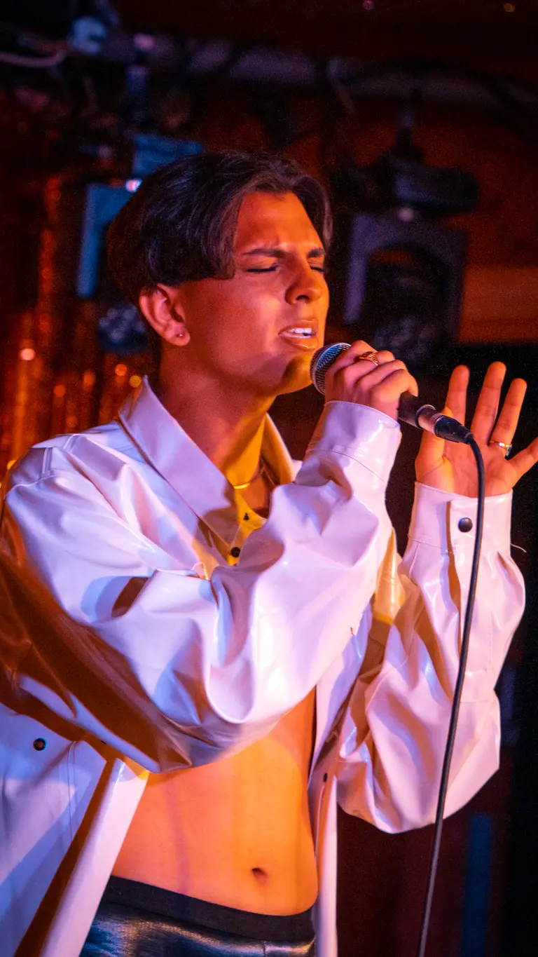 jason patel on stage singing
