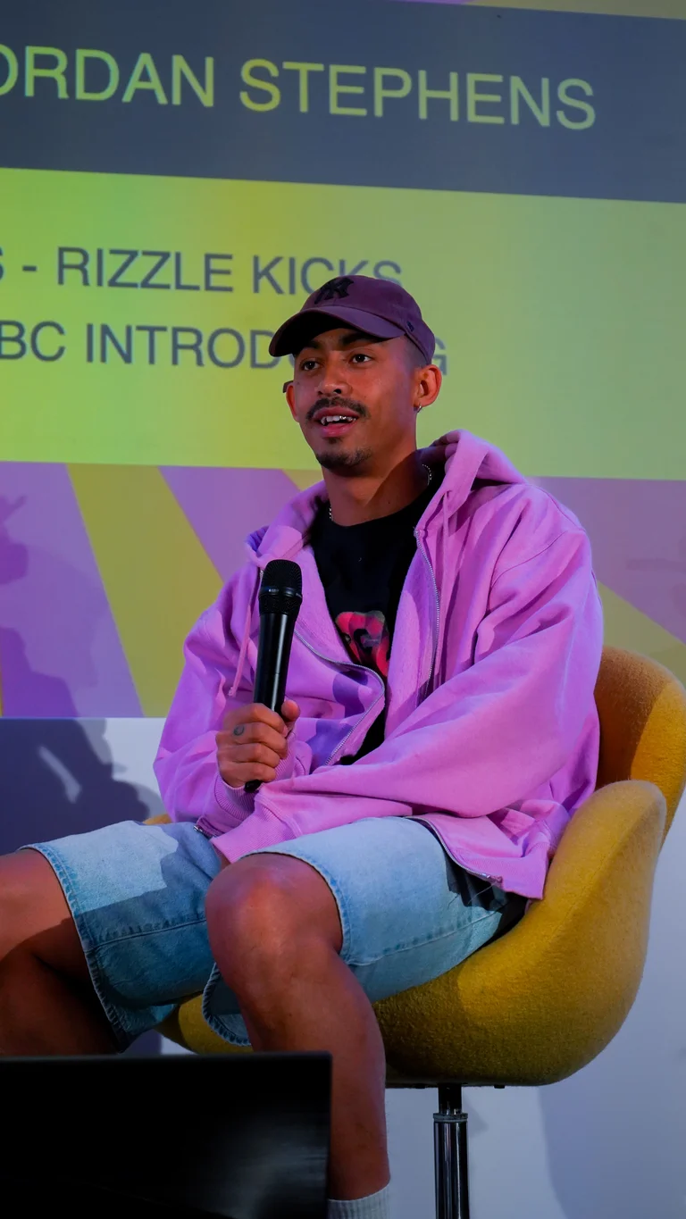 jordan stephens wears a pink jumper on the panel