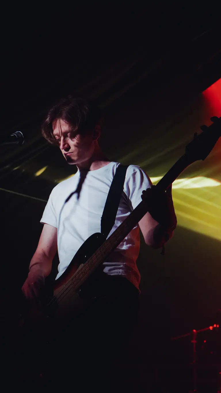 english teacher's lewis whiting plays the electric guitar