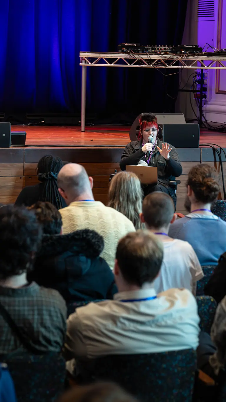 elizabeth birch gives a speech to an audience