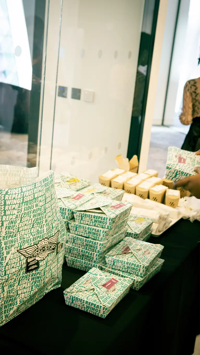 wingstop branded boxes filled with food