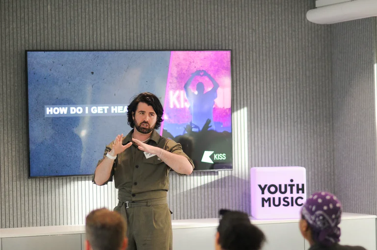 jordan lee presents to an audience