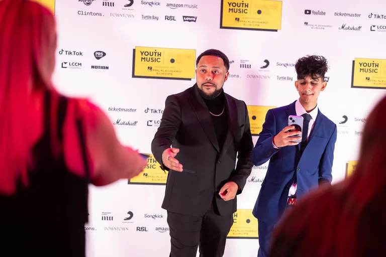 Benjamin Turner in a suit posing at the YMAs '24